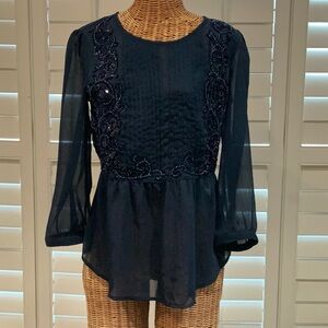 Navy Peplum Blouse w/Flutter Sleeves & Sequin Embellishment